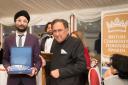 Honoured: Param Singh receives his award from Baron Sheikh