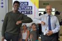 Uxbridge College’s top performer at GCSE this year was Toluwalase Lawale, pictured left, doing the 'Covid handshake' with Principal Dr Darrell DeSouza
