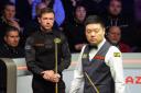 Jack Lisowski, left, leads Ding Junhui after an entertaining opening session (Martin Rickett/PA)