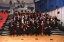 Uxbridge College HNC & HND achievers celebrate their graduation at Brunel University London with the traditional custom of throwing their mortar boards in the air