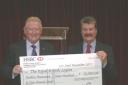 Good work: Ray Puddifoot, right, presents the cheque to Russell Thompson