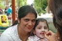 Tajpreet Kaur, age two, pictured with mum Sarbjit is transformed into a rabbit at Uxbridge College Children's Centre.