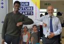 Uxbridge College’s top performer at GCSE this year was Toluwalase Lawale, pictured left, doing the 'Covid handshake' with Principal Dr Darrell DeSouza