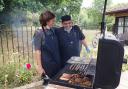 Warm work: manager Rebekah Axford and kitchen assistant Joe Hussain at the barbecue