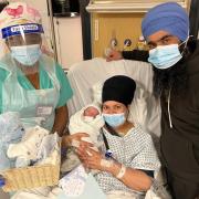 Welcome to the world: Kulwinder and Sukhdev with their new arrival and Lynn Kennedy