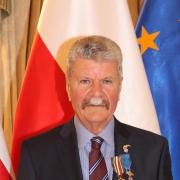 Honoured: Sir Ray proudly wearing his two medals