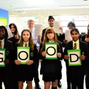 Good work, everyone: Staff and pupils mark the encouraging Ofsted report. Picture: Tom Barnes