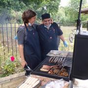 Warm work: manager Rebekah Axford and kitchen assistant Joe Hussain at the barbecue