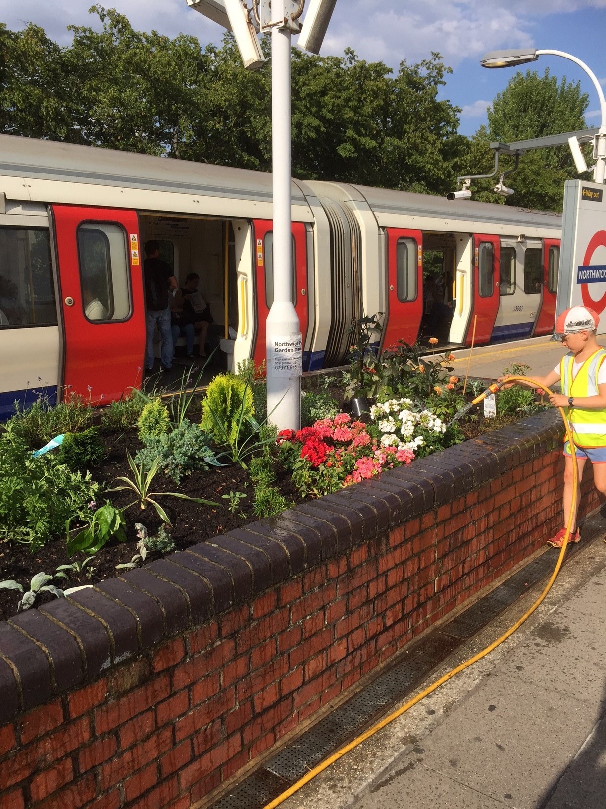 Commuters take snaps of seven-year-old boy’s finished garden at train station