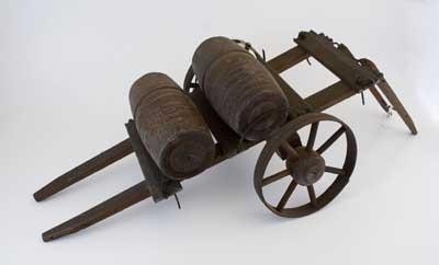 Mid-19th Century model of a two-wheeled cart with two barrels.
