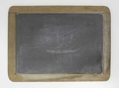 School writing slate used circa 1905 at New Windsor Street Infants School.
In Victorian times paper was very expensive, therefore school children wrote on slabs of slate, which were less expensive and more durable, with pencils made of soft slate.