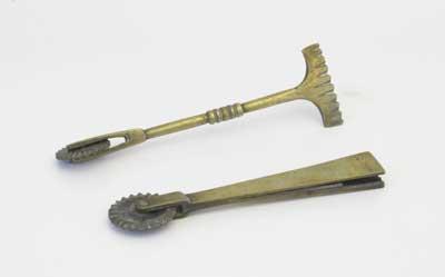 Late Victorian pastry crimpers or jiggers. These tools used for pastry decoration were donated by F. Lurkins in 2002. These jiggers have one end fitted with a serrated brass wheel for cutting out pastry and the other end shaped to crimp the edge.