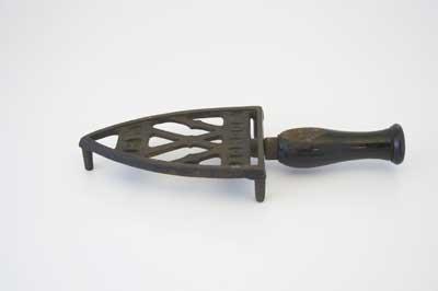 Victorian trivets were made in many shapes and designs. Flat irons were heated on the iron hob of the kitchen range. When the iron maid needed to put the iron down she used the iron stand.

