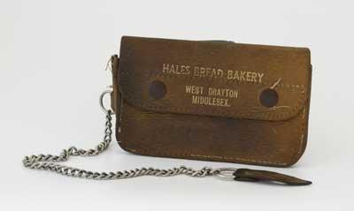 Brown leather wallet with chain and leather button hole to attach to belt belonging to Hales Bread Bakery, West Drayton.