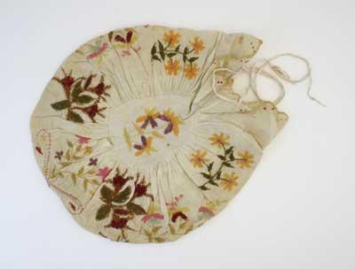 Donated by Miss W Tinto in 1982. In Victorian times embroidery was practiced widely by ladies. From tea cosies to samplers, gentlewomen were encouraged to learn the art of embroidery. 
