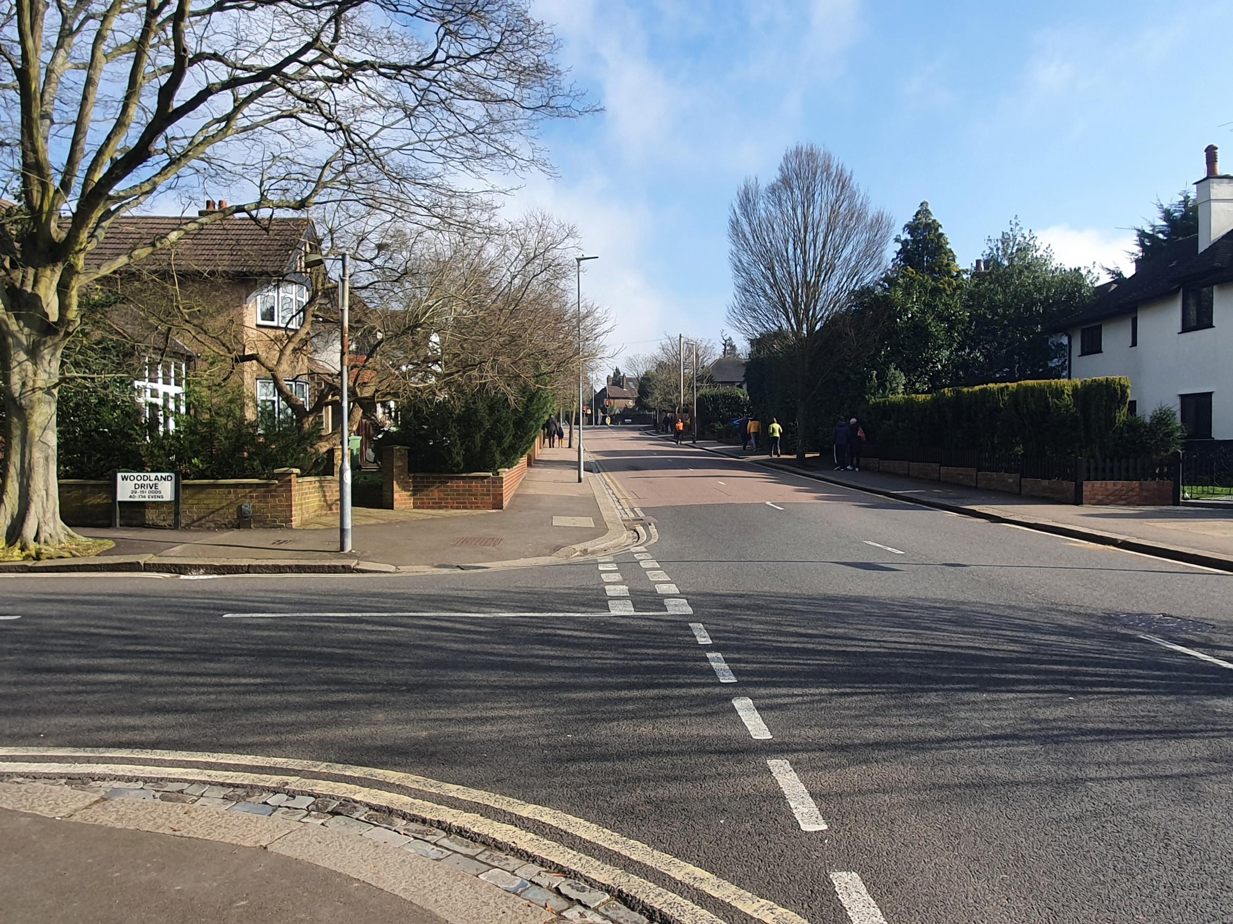 Junction of Woodland Drive and Stratford Way, showing the route drivers would need to take to the estates shops if the estate was split