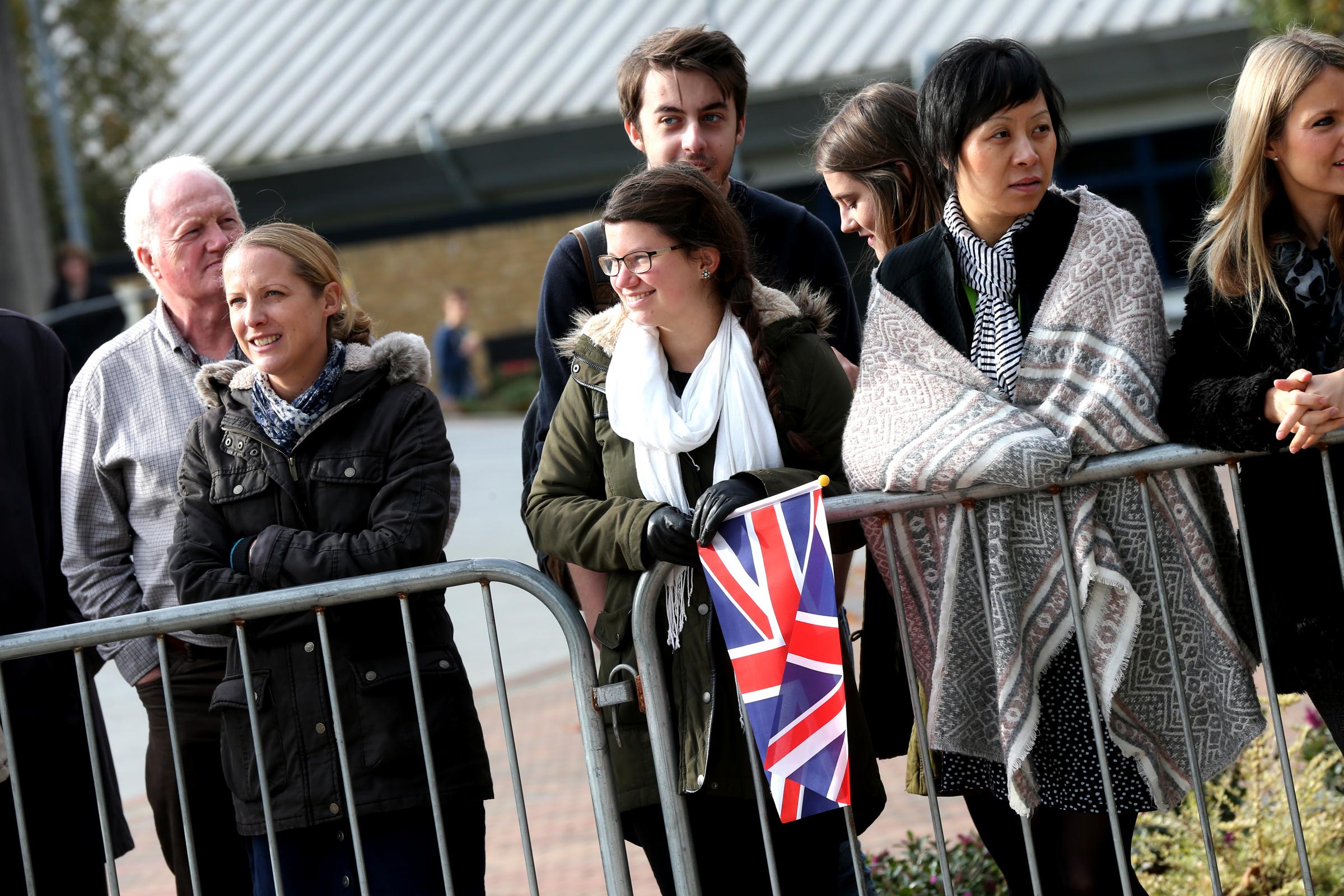 People wait to greet the Duke of Edinburgh during his visit
