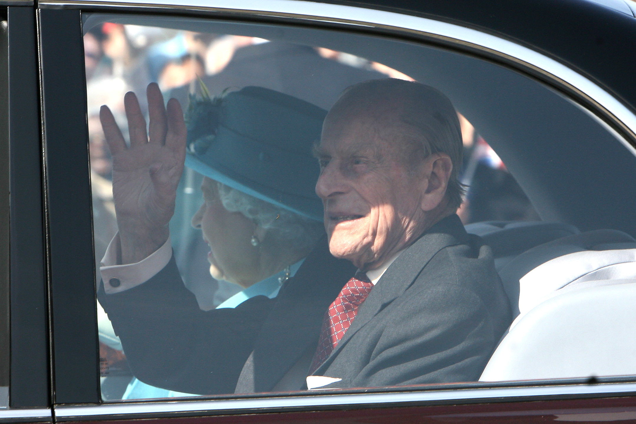 Royal Highness The Duke of Edinburgh waves at crowds outside Walthamstow Town Hall