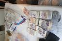 Over £400,000 of dirty cash seized in Wembley and Islington police raids