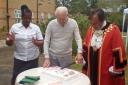 Let's eat cake: resident Fredrick  Fisher with manager  Patience Sibanda and the mayor
