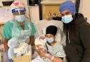 Welcome to the world: Kulwinder and Sukhdev with their new arrival and Lynn Kennedy