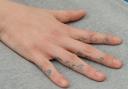 Distinctive: Webb's tattooed hand