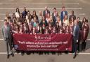 Flying the flag: some staff and pupils celebrate the Ofsted rating