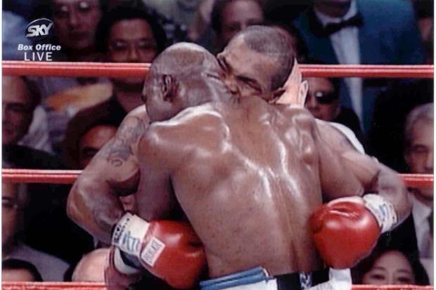 Tyson bites Holyfield