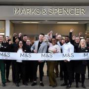 Ready at the tills: M & S staff in Uxbridge this morning