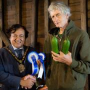 Prize effort: Peter Bird with his best in show cucumbers meets the mayor