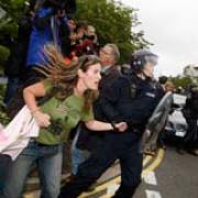 A protester is led away by police. PICTURE: Simon Jacobs.