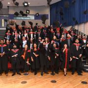 Uxbridge College HNC & HND achievers celebrate their graduation at Brunel University London with the traditional custom of throwing their mortar boards in the air
