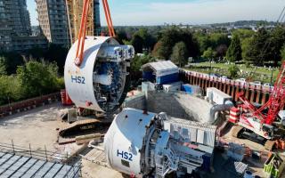 Going down: Emily is lowered into position ahead of its journey underneath West London
